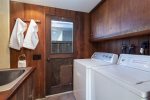 Laundry room off main hall offers washer and dryer for guest use